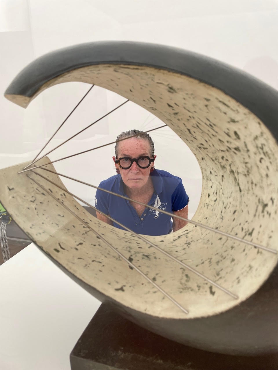 A visitor views art through a Barbara Hepworth sculpture at the Foundation Maeght.