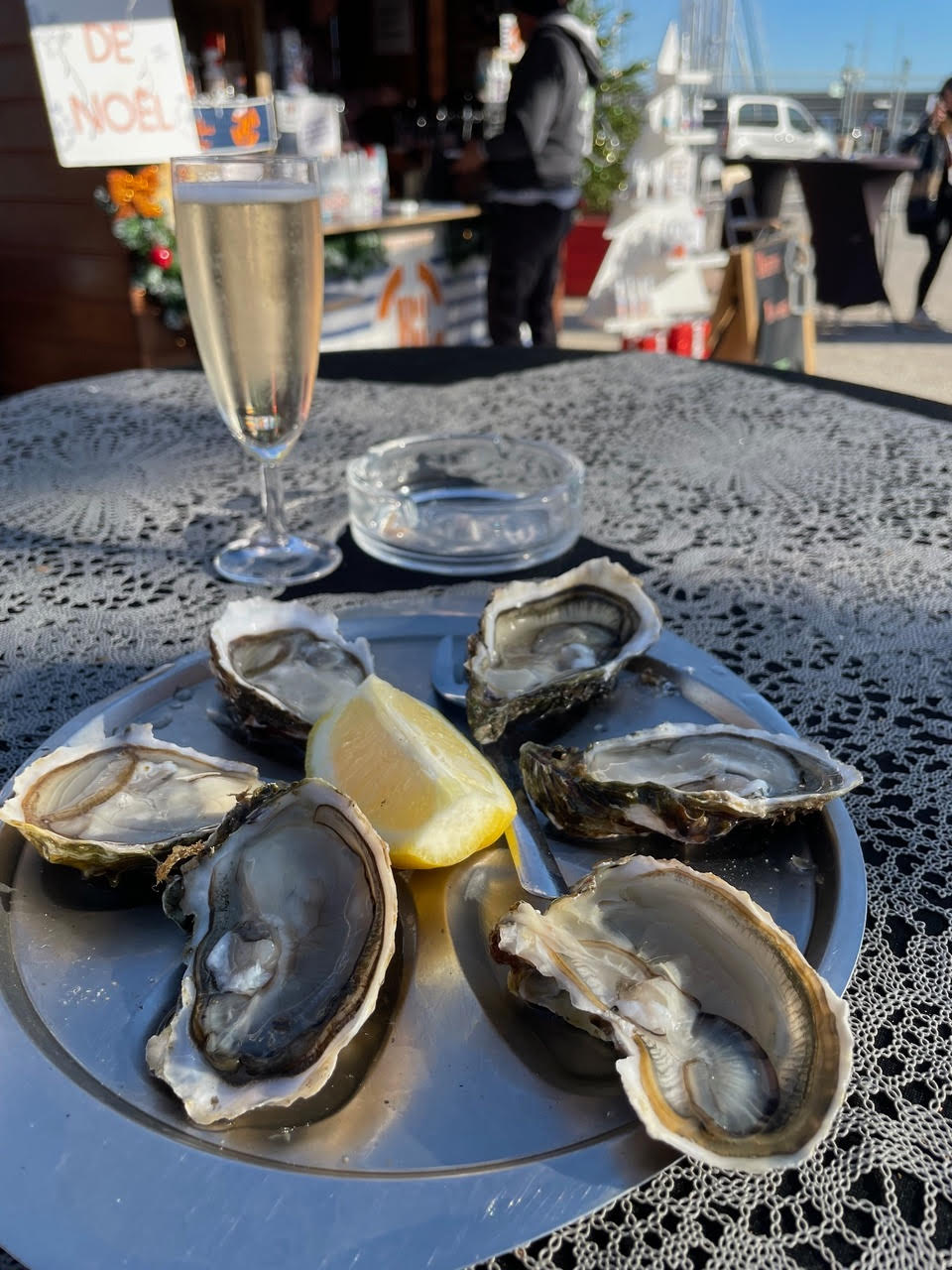 Six oysters and a glass of champagne at the Christmas Village in Antibes.