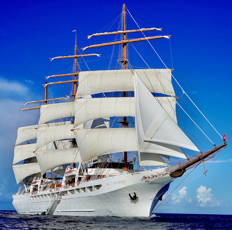 The Sea Cloud Spirit under full sail on the open sea.