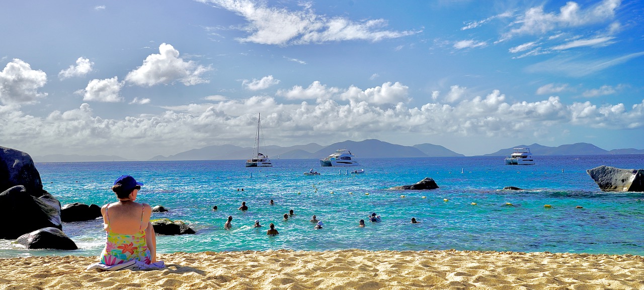 Swimmers and snorkelers in turquoise water at the Baths on Virgin Gorda.