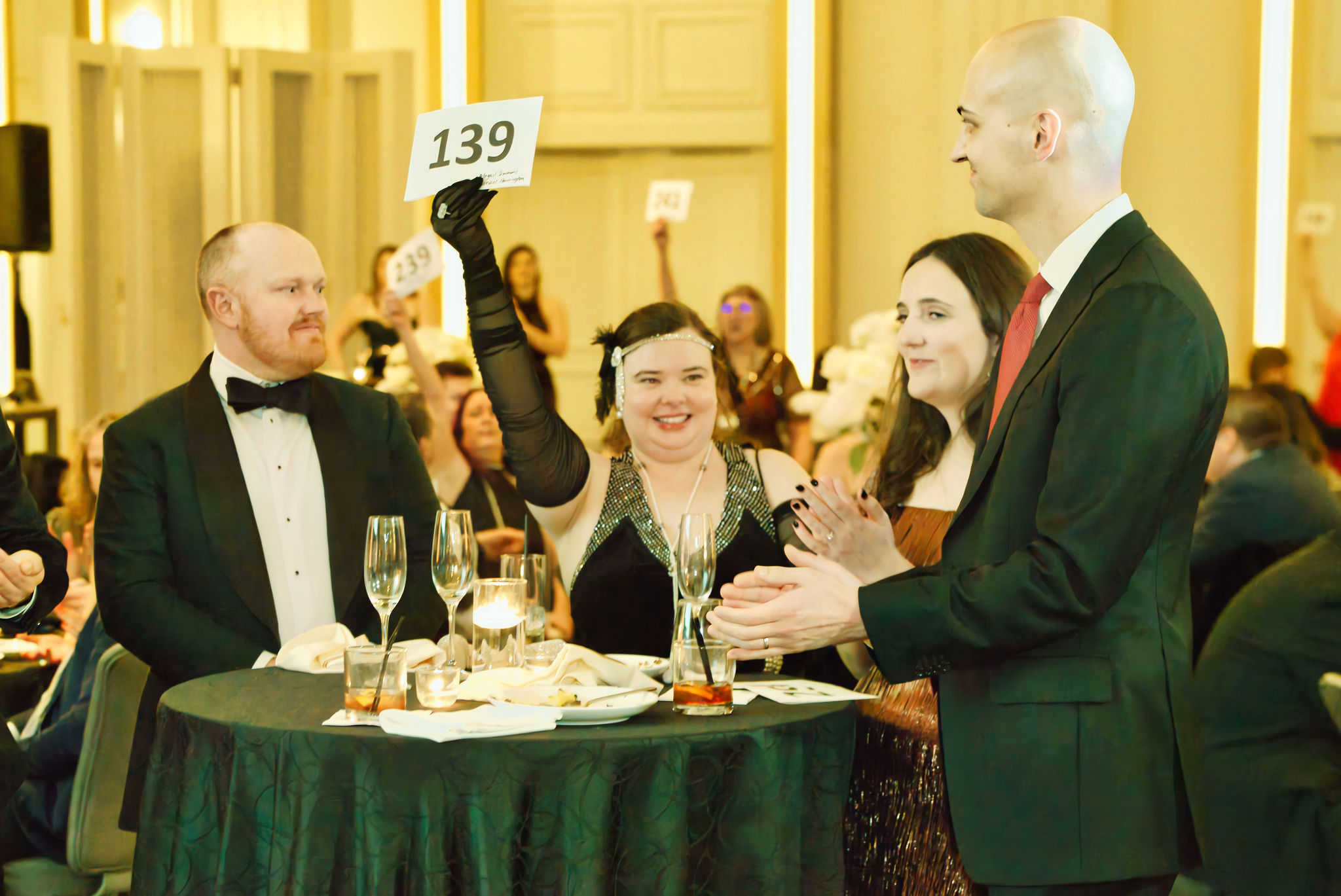 JLC Advocacy Director-Elect Abigail Simmons and others participate in paddle raise