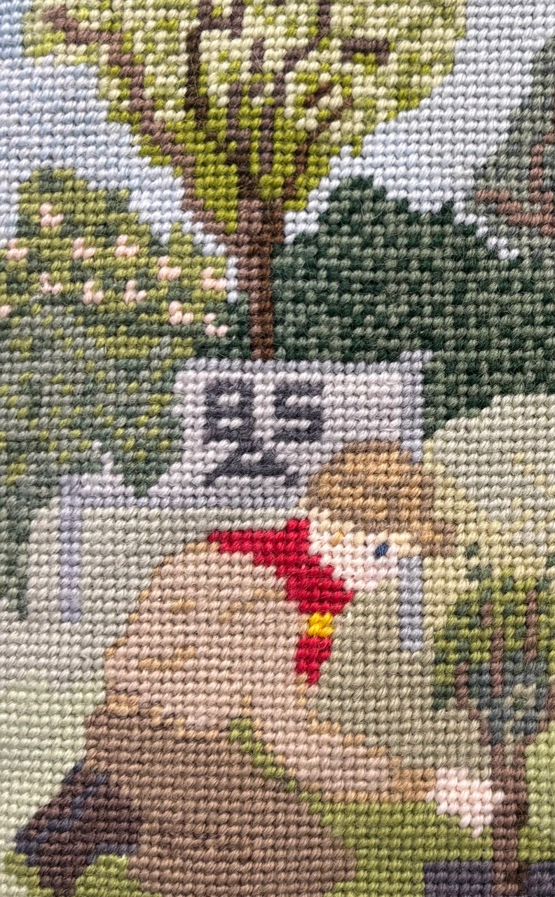 Needlepoint boy and tree