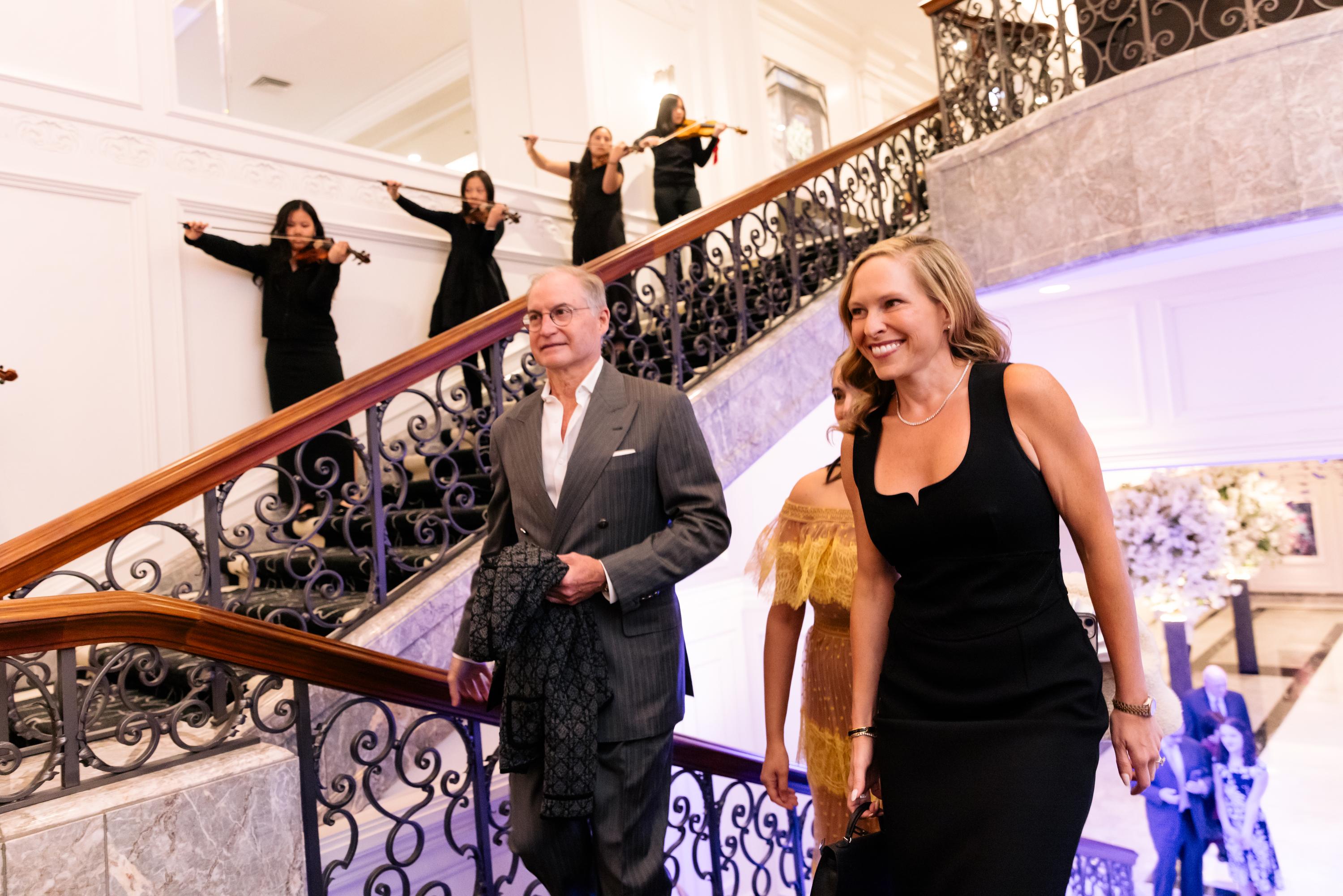 Guests arrive at the Merit Gala