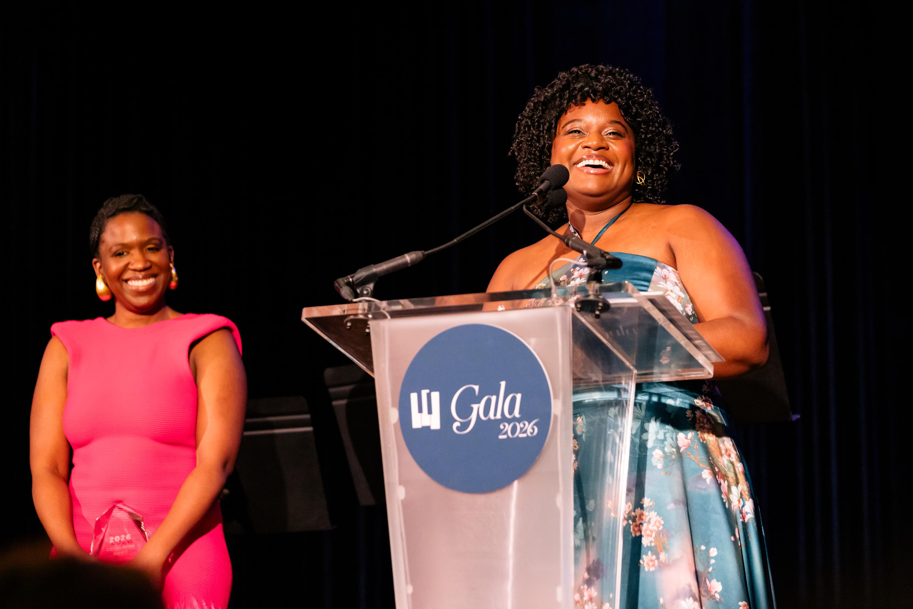 Khelsey Zarraga and Kori Coleman accept award for D-Composed