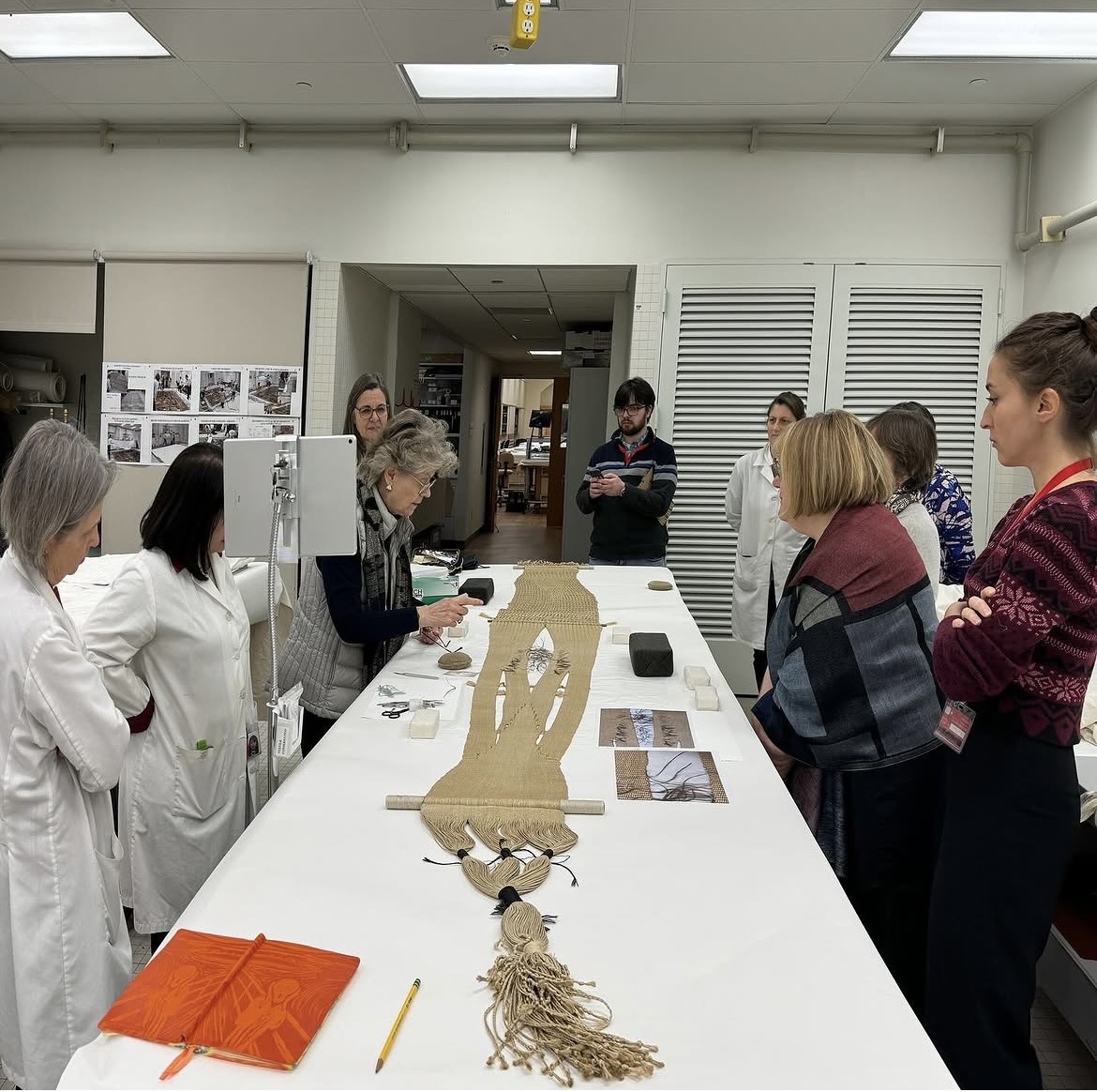 Examining textile samples at the Antonio Ratti Center