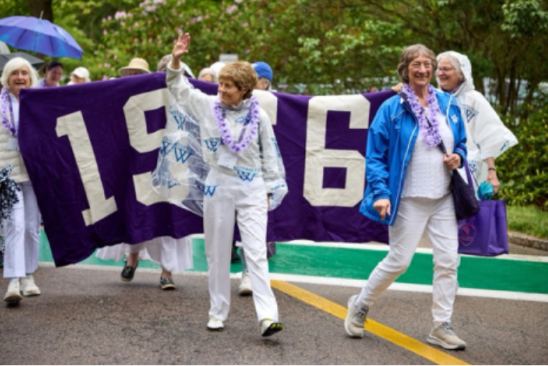 Diana Chapman, former Wellesley College president and member of class of 1966, waves to her fans during the alumnae parade.