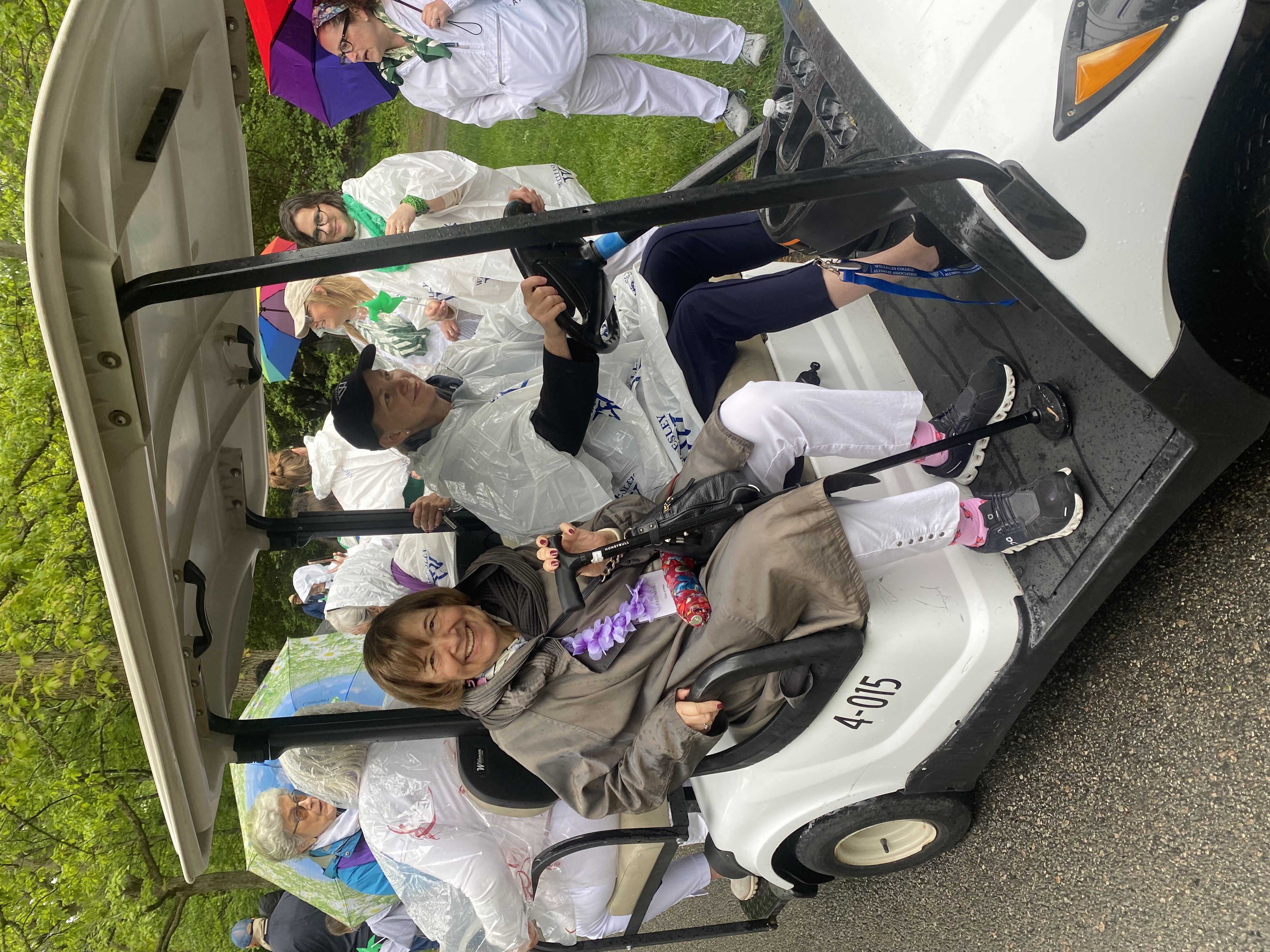 Marji Siegal Greenberg, class of 1966, catches a ride in the alumnae parade.