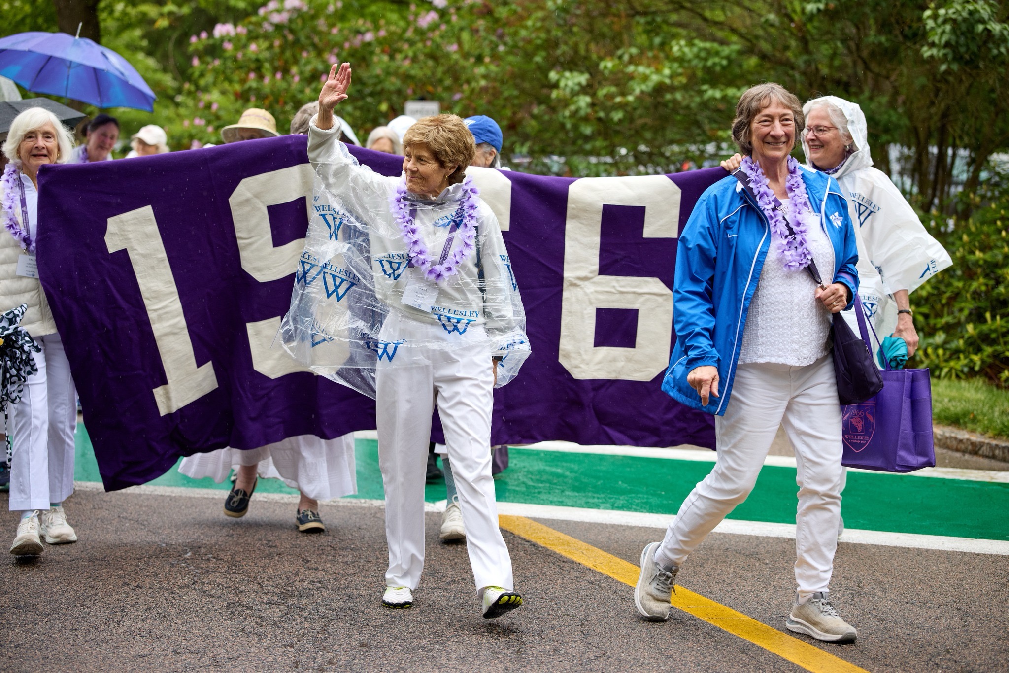 Diana Chapman, former Wellesley College president and member of class of 1966, waves to her fans during the alumnae parade.