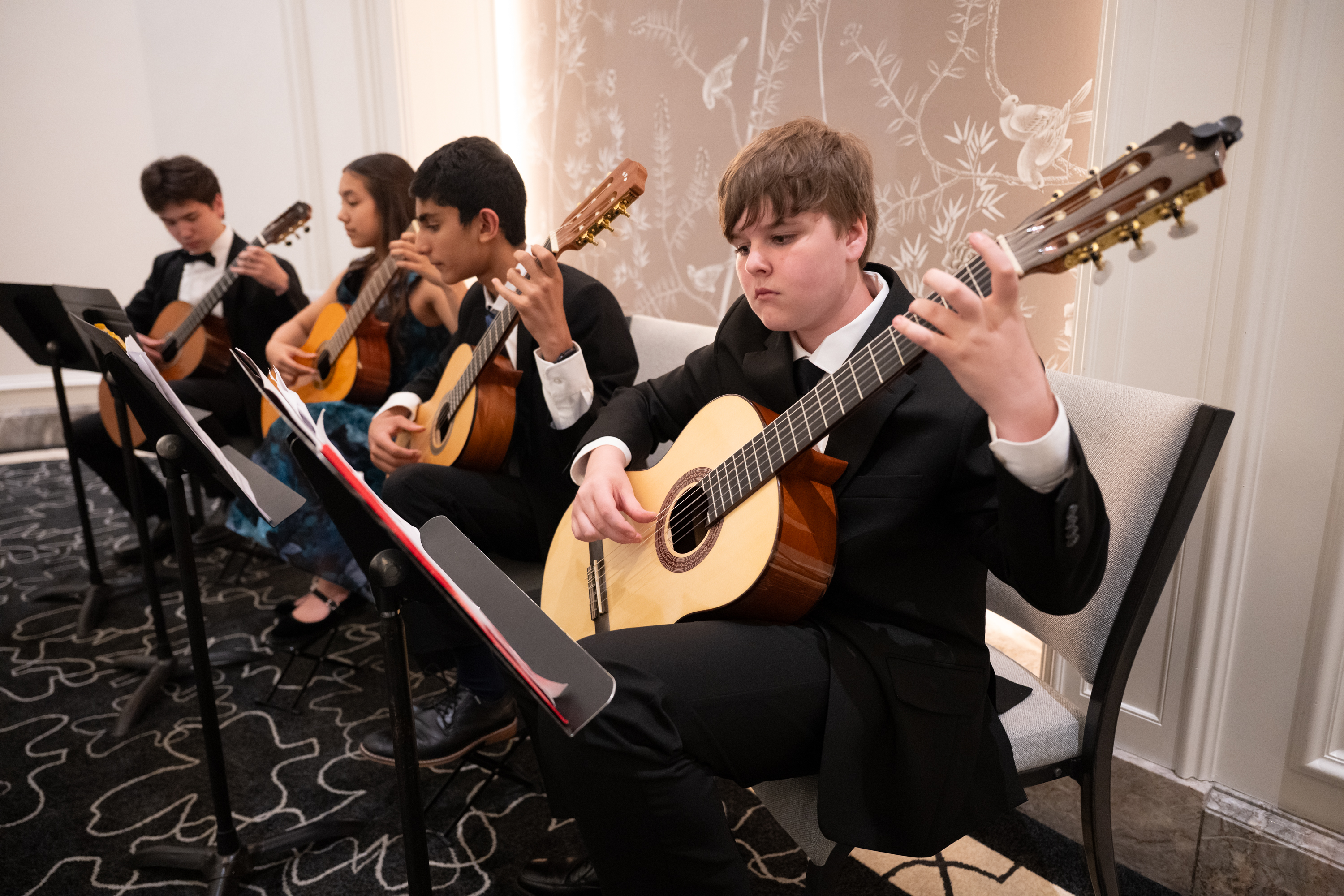 Music Institute guitar students perform during the cocktail reception