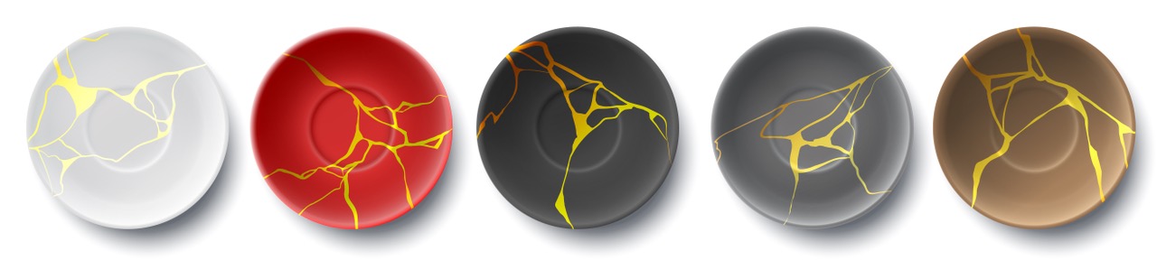 Five kintsugi-style plates in different colors