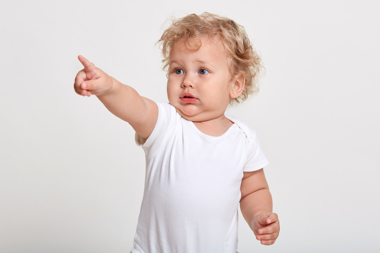 A toddler pointing