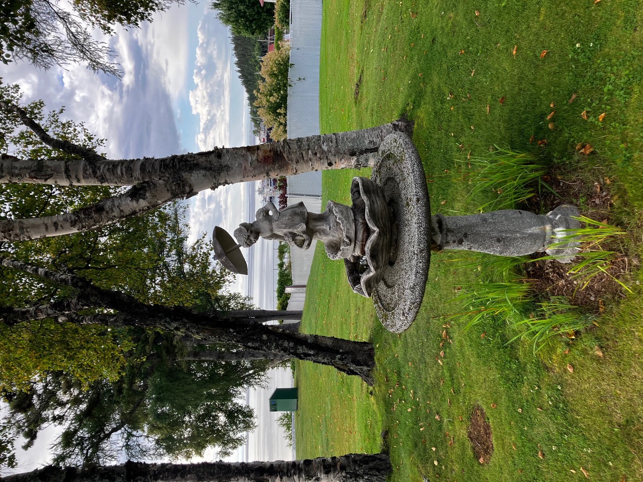 A statue on the hotel lawn overlooking the water