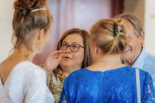 A small group of guests deep in conversation