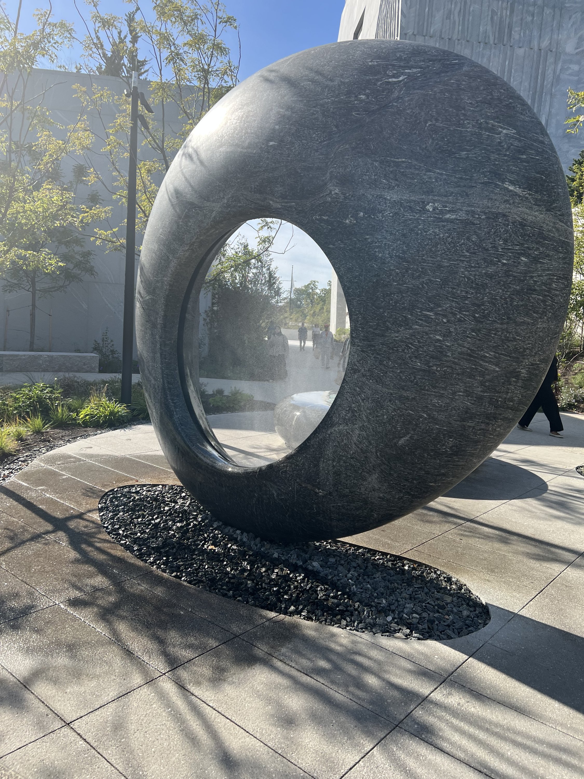 View from the East, “Seeing Through the Universe,” Maya Lin’s sculptural water installation, two rounded granite forms, Outdoor Grounds/ Ann Dunham Water Terrace/ Obama Presidential Center. September 2026. Photo: S. Zetouni